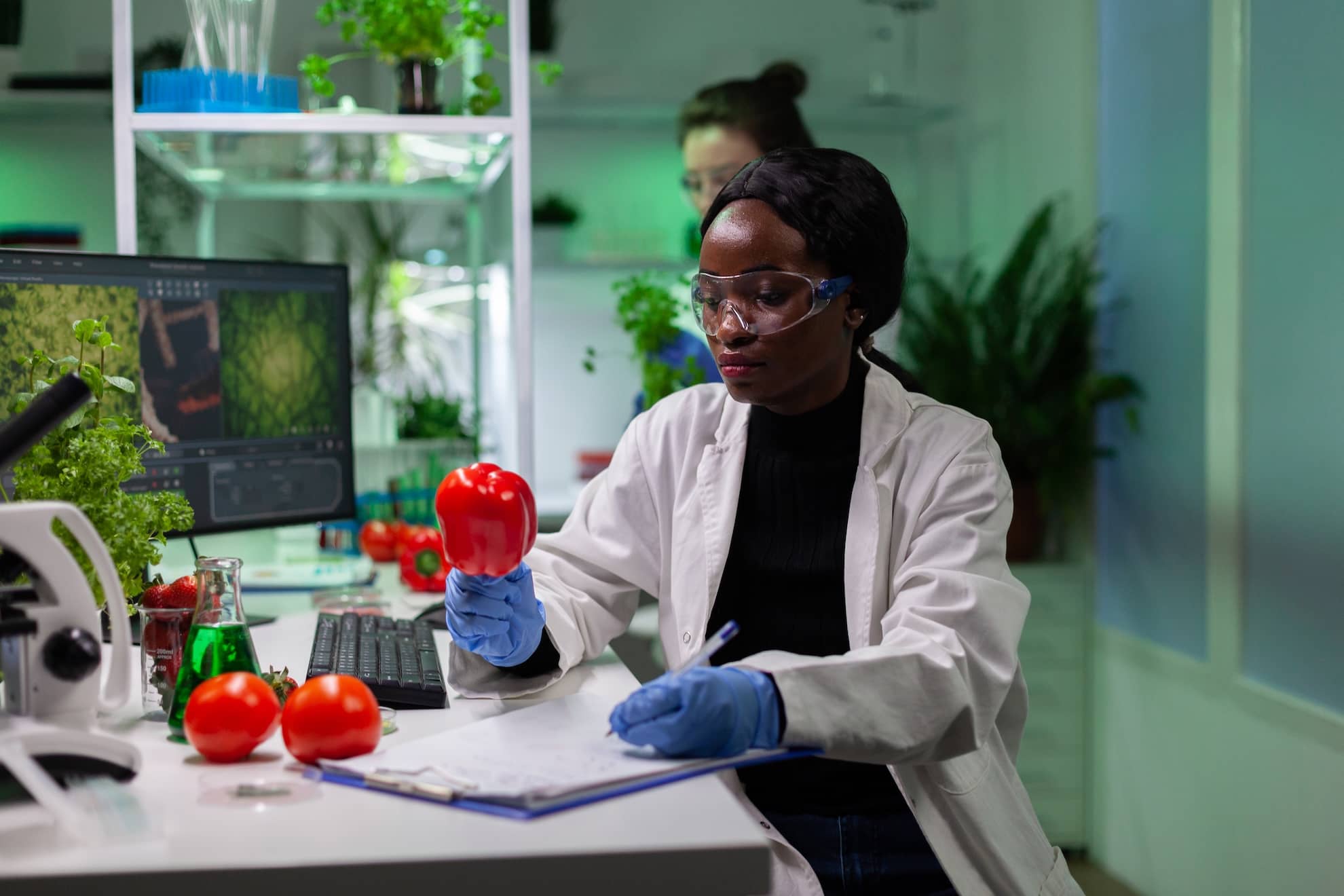 african-american-biologist-reseacher-analyzing-pepper